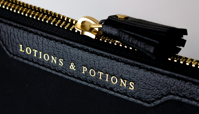 LOTIONS AND POTIONS POUCH ANYA HINDMARCH